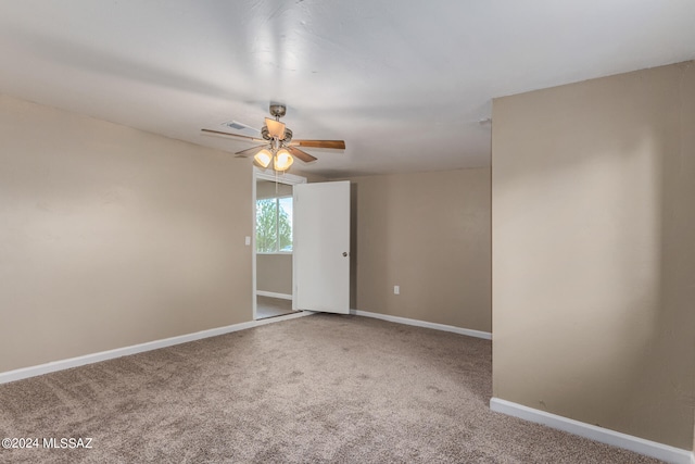 carpeted empty room with ceiling fan