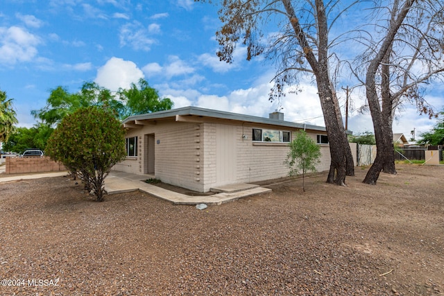 view of side of property featuring a patio