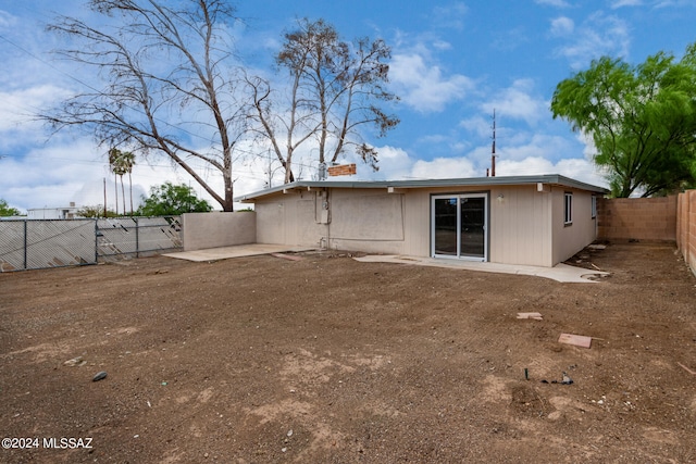 rear view of property featuring a patio area