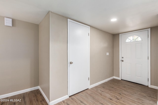 foyer entrance with light hardwood / wood-style flooring