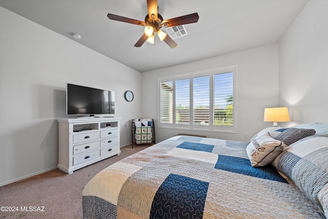 bedroom featuring vaulted ceiling, ceiling fan, and light colored carpet