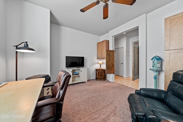 carpeted office featuring ceiling fan