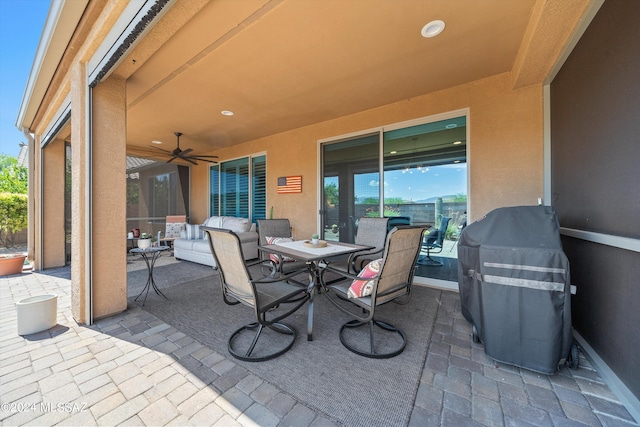 view of patio with outdoor lounge area, area for grilling, and ceiling fan