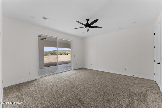 spare room with carpet and ceiling fan