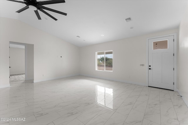 empty room featuring vaulted ceiling and ceiling fan