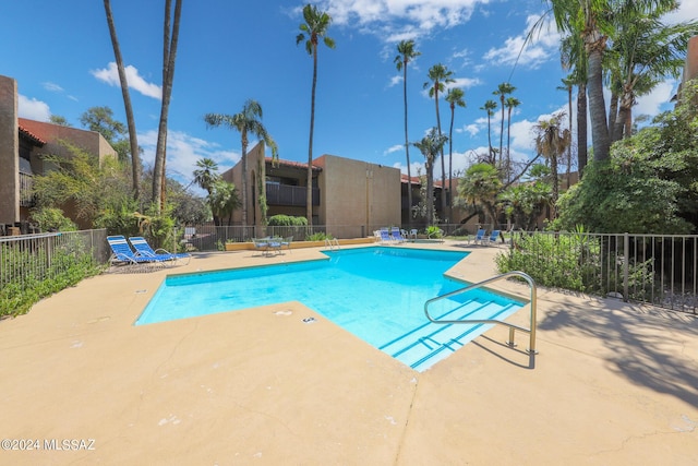 view of swimming pool featuring a patio