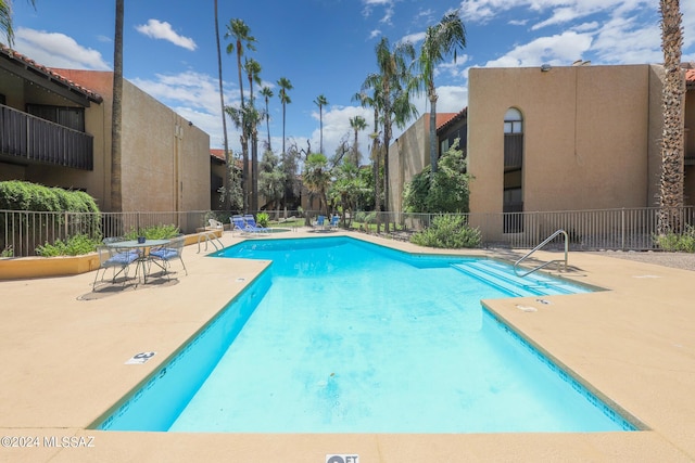 view of swimming pool featuring a patio area