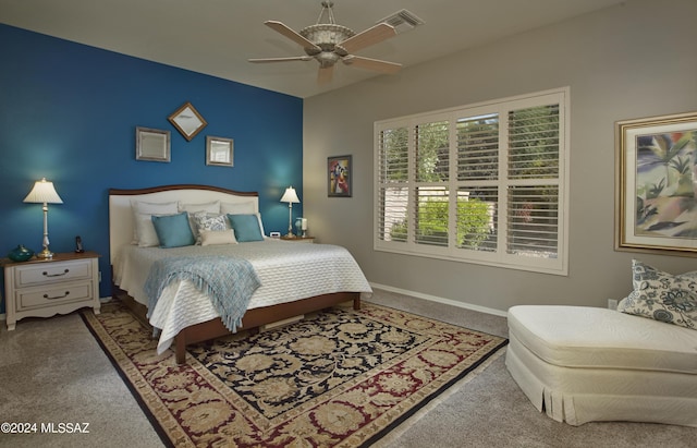 bedroom with baseboards, ceiling fan, and carpet