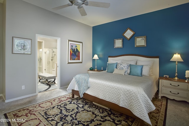 carpeted bedroom featuring connected bathroom, baseboards, and ceiling fan
