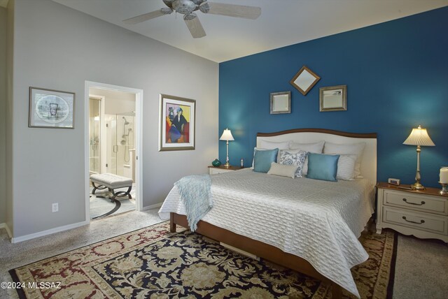 bedroom featuring connected bathroom, light colored carpet, and ceiling fan