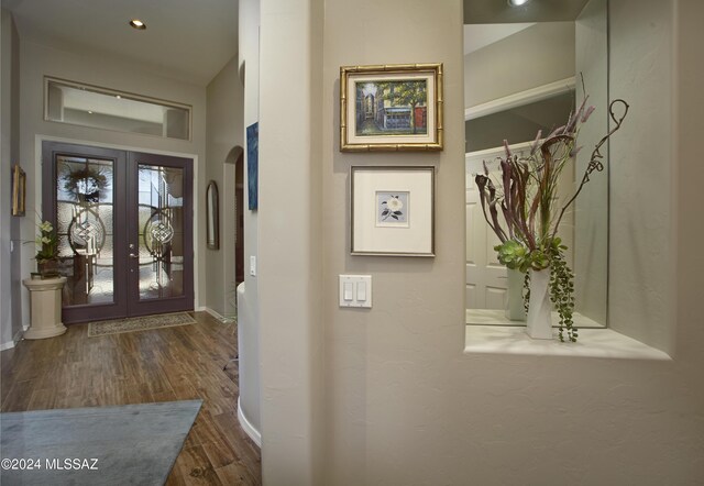 foyer with french doors and dark wood-type flooring