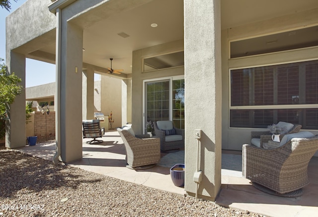 view of patio / terrace with a ceiling fan and outdoor lounge area