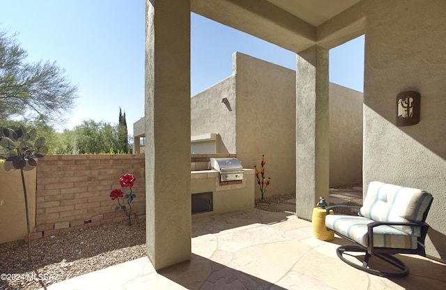 view of patio / terrace featuring a grill, fence, and area for grilling