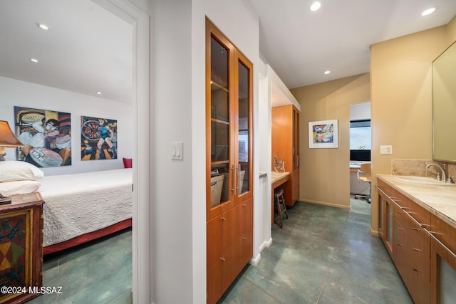 bathroom featuring vanity and concrete floors