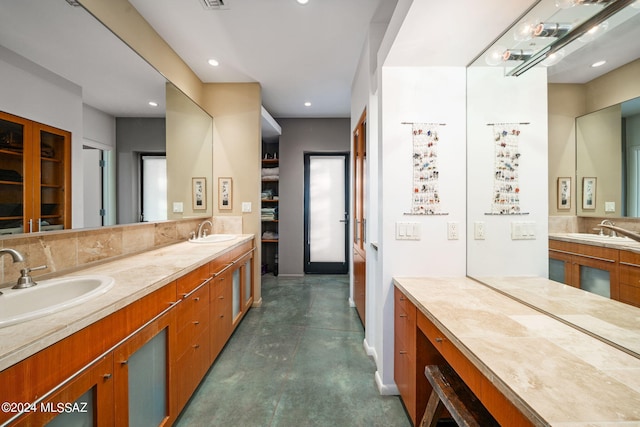 bathroom featuring concrete flooring and vanity