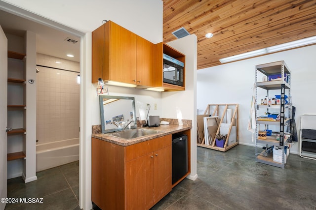 kitchen with wood ceiling, black microwave, and sink