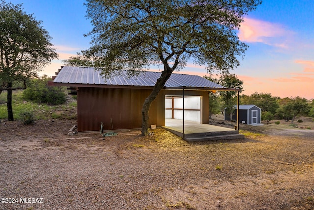 exterior space featuring a storage unit