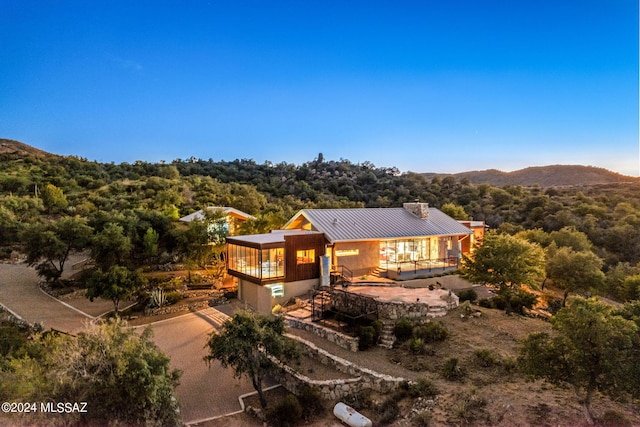 exterior space featuring a patio and a mountain view