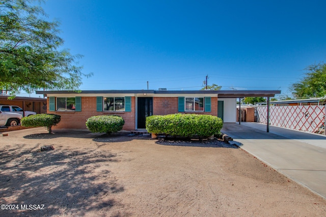 single story home with a carport