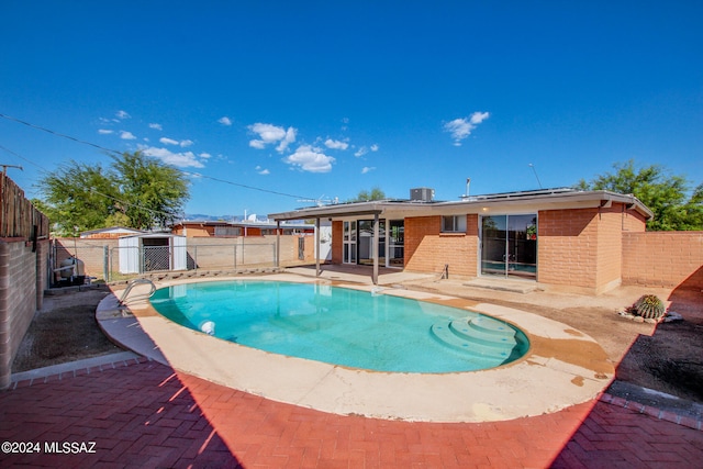 view of swimming pool featuring a patio area