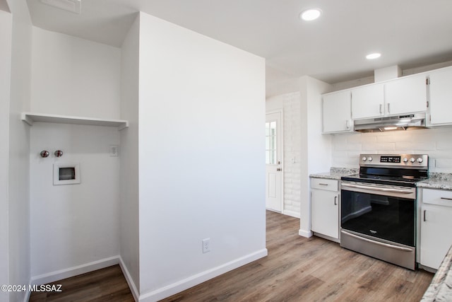 kitchen featuring stainless steel range with electric stovetop, light wood-type flooring, and white cabinets