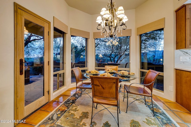 sunroom featuring a chandelier