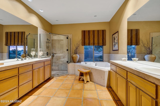 bathroom with vanity, shower with separate bathtub, and tile patterned flooring