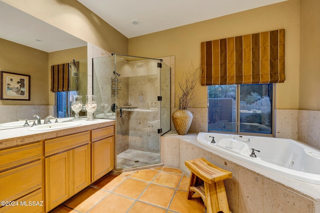 bathroom featuring separate shower and tub, tile patterned floors, and vanity