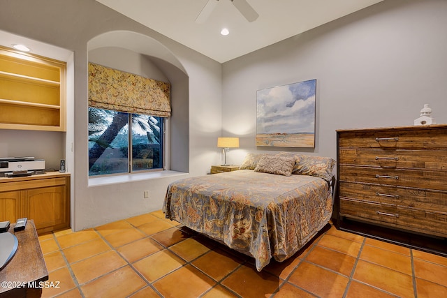 bedroom featuring light tile patterned floors and ceiling fan