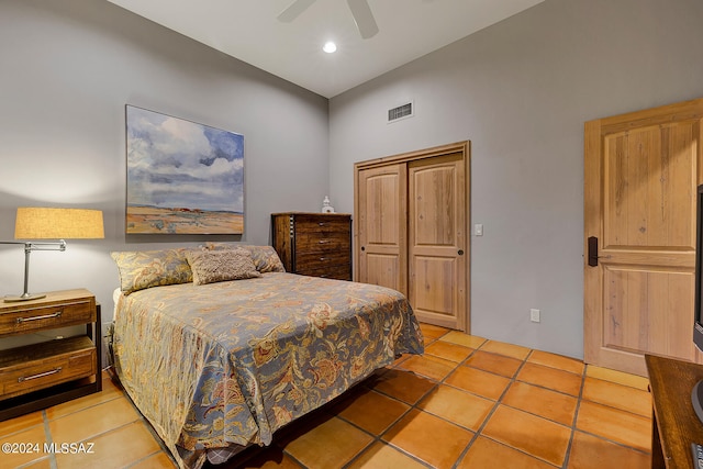 bedroom featuring light tile patterned flooring, high vaulted ceiling, and ceiling fan