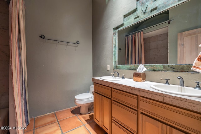 bathroom featuring tile patterned flooring, a shower with shower curtain, vanity, and toilet