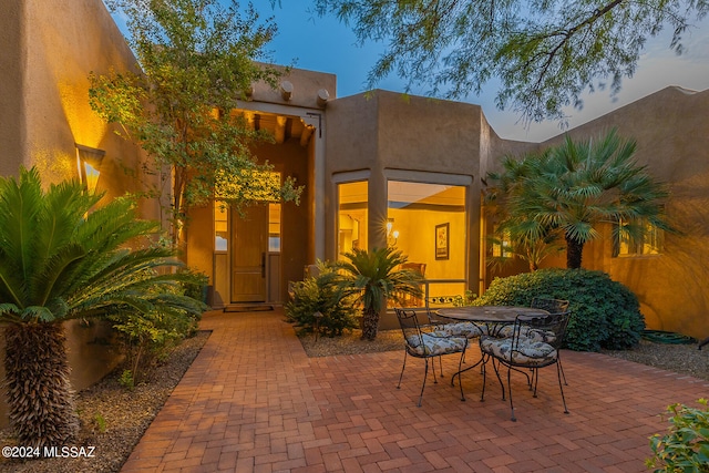 view of patio terrace at dusk