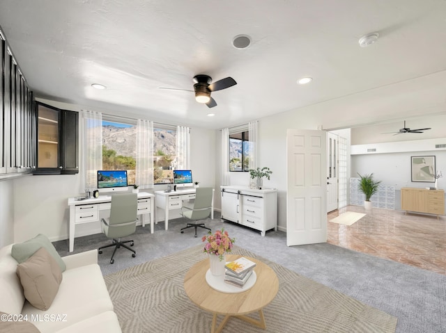 home office featuring tile patterned flooring and ceiling fan