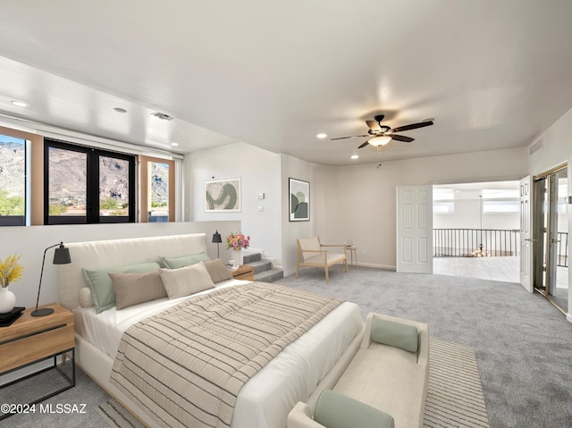 bedroom featuring access to exterior, ceiling fan, and light colored carpet