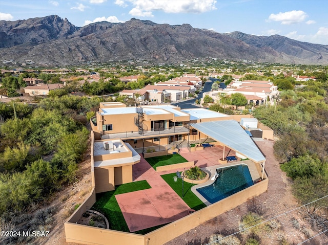 birds eye view of property featuring a mountain view