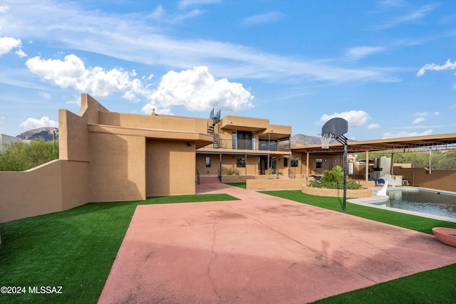 rear view of house featuring a patio