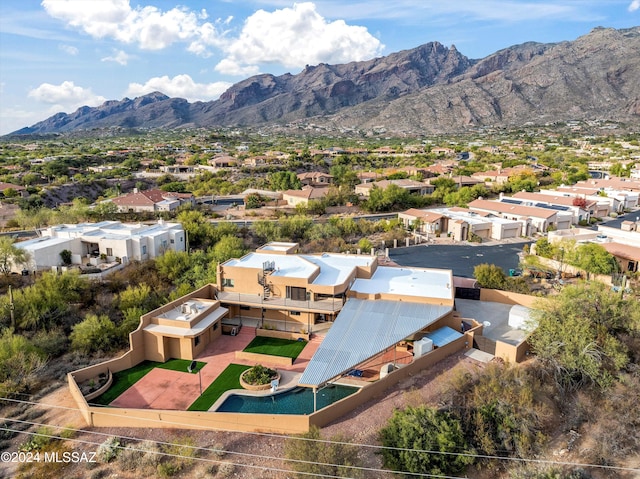 birds eye view of property featuring a mountain view