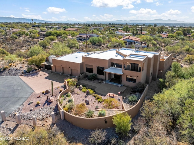 birds eye view of property featuring a mountain view