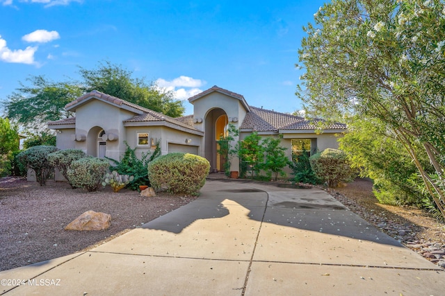 875 S Deer Meadow Loop, Tucson, AZ 85745 - mediterranean / spanish home with a garage, stucco siding, a tiled roof, and concrete driveway