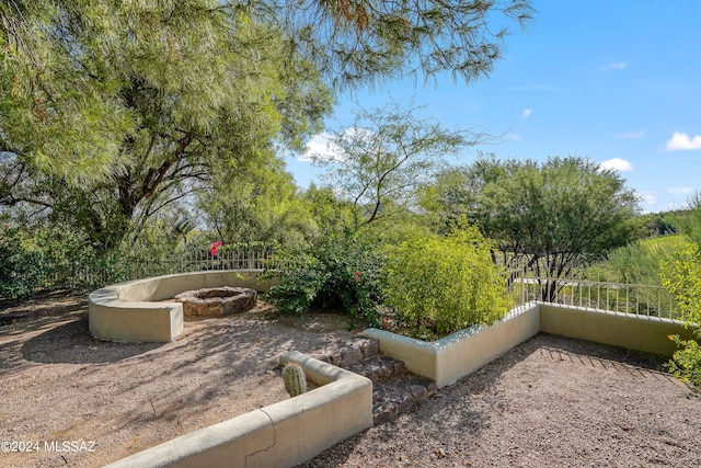 875 S Deer Meadow Loop, Tucson, AZ 85745 - view of yard with an outdoor fire pit and fence