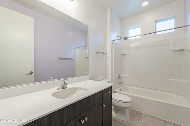 full bathroom featuring tile patterned flooring, vanity, toilet, and bathing tub / shower combination