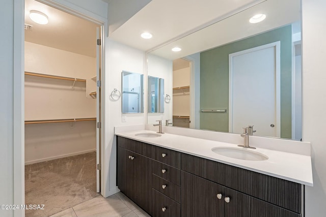 bathroom featuring tile patterned floors and vanity