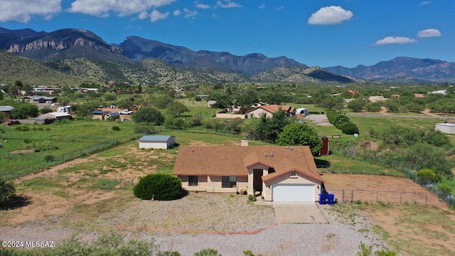 drone / aerial view featuring a rural view and a mountain view