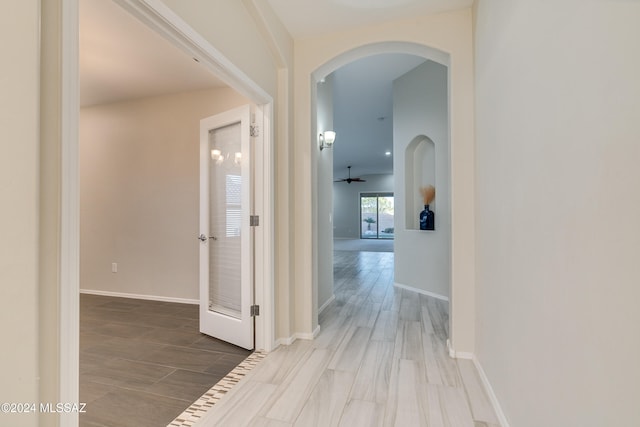 hall with hardwood / wood-style floors