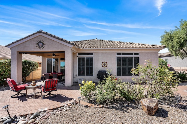 back of house featuring a patio and ceiling fan