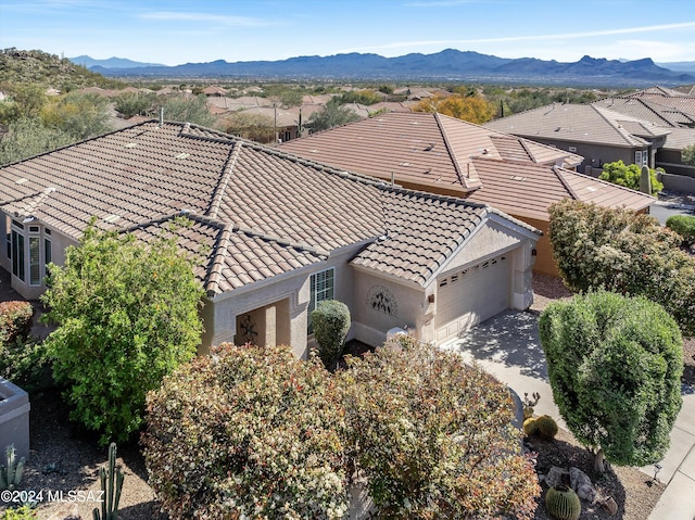 birds eye view of property with a mountain view