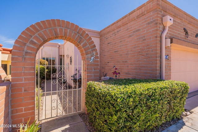 doorway to property featuring a garage