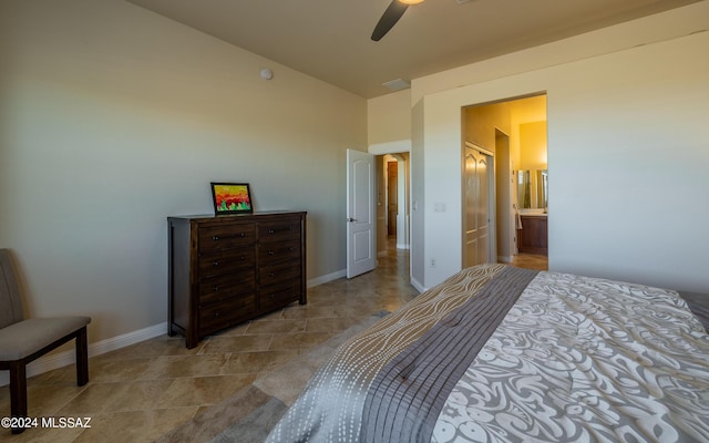 bedroom featuring ensuite bath and ceiling fan