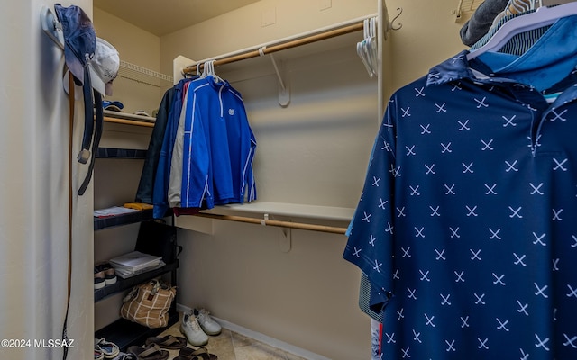 spacious closet featuring tile patterned floors