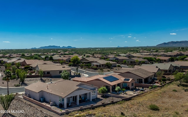 birds eye view of property featuring a mountain view